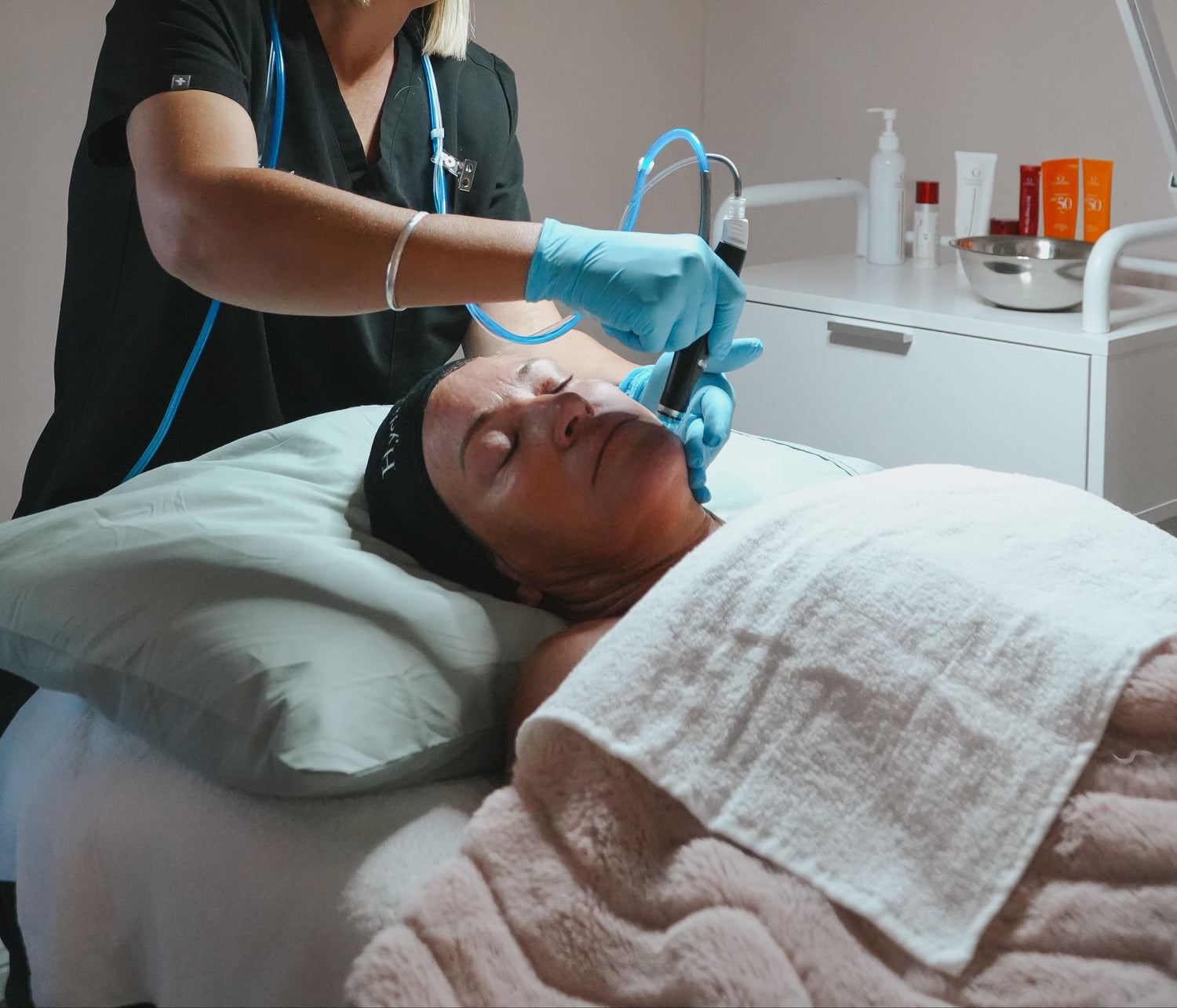 woman receiving hydrafacial treatment